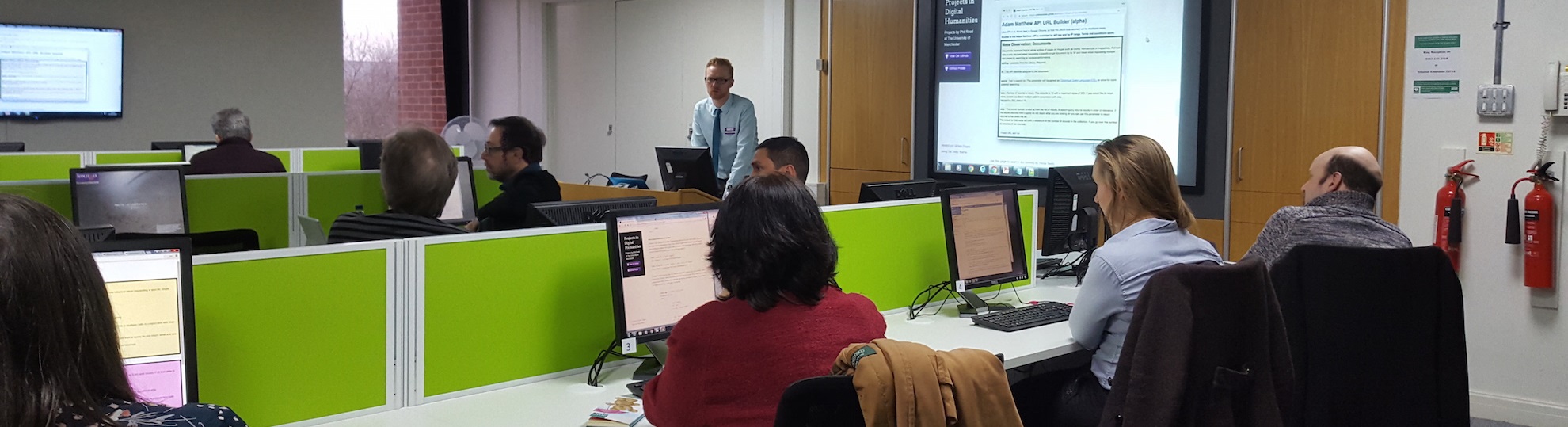 Photo of Phil teaching in a computer cluster